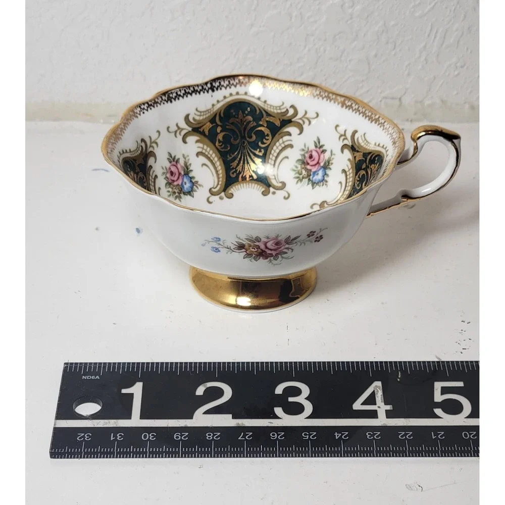 Paragon teacup - dark green panels on white background with floral‎ decor...Read